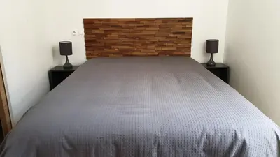 Un ou plusieurs lits dans un hébergement de l'établissement La maison de toujours