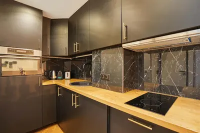 Cuisine ou kitchenette dans l'établissement Apartment center of Paris by Studio prestige