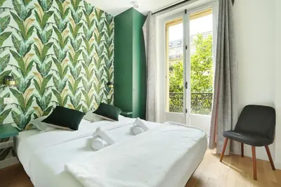 Un ou plusieurs lits dans un hébergement de l'établissement Résidence Center of Paris by Studio prestige