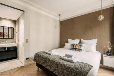 Un ou plusieurs lits dans un hébergement de l'établissement HIGHSTAY - Luxury Serviced Apartments - Rue de Rivoli