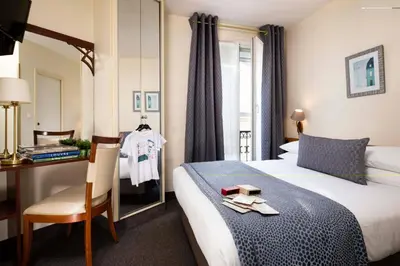 Un ou plusieurs lits dans un hébergement de l'établissement Grand Hotel des Balcons