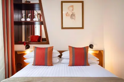Un ou plusieurs lits dans un hébergement de l'établissement Grand Hotel des Balcons