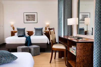 Un ou plusieurs lits dans un hébergement de l'établissement Grand Hotel des Balcons