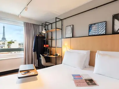Un ou plusieurs lits dans un hébergement de l'établissement Ibis Paris Tour Eiffel Cambronne 15ème