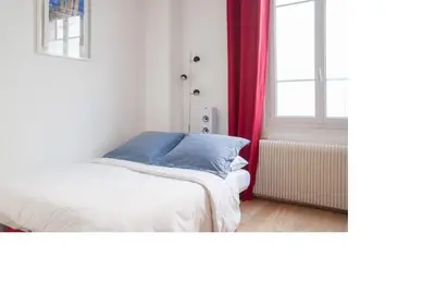 Un ou plusieurs lits dans un hébergement de l'établissement La petite maison parisienne