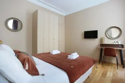 Un ou plusieurs lits dans un hébergement de l'établissement Apartment Champ de Mars - Tour Eiffel by Studio prestige