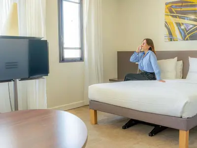 Télévision ou salle de divertissement dans l'établissement Novotel Suites Paris Montreuil Vincennes