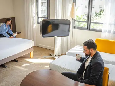 Télévision ou salle de divertissement dans l'établissement Novotel Suites Paris Montreuil Vincennes