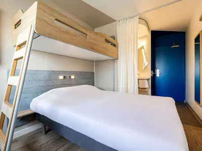 Un ou plusieurs lits dans un hébergement de l'établissement ibis budget Paris Porte d'Italie Ouest