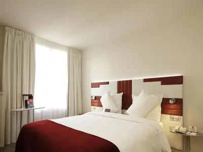 Un ou plusieurs lits dans un hébergement de l'établissement Mercure Paris Opéra Faubourg Montmartre