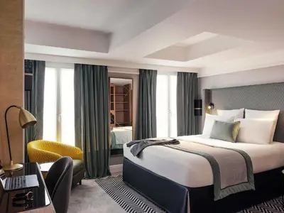 Un ou plusieurs lits dans un hébergement de l'établissement Mercure Paris Opera Garnier Hôtel & Spa