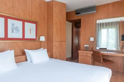 Un ou plusieurs lits dans un hébergement de l'établissement Best Western Ronceray Opéra