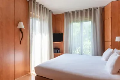 Un ou plusieurs lits dans un hébergement de l'établissement Best Western Ronceray Opéra