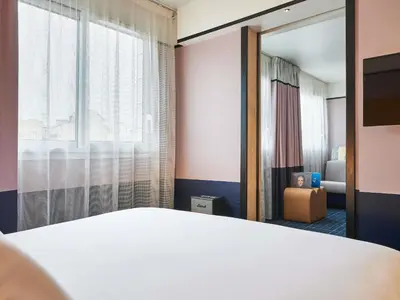 Un ou plusieurs lits dans un hébergement de l'établissement Mercure Paris 15 Porte de Versailles