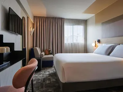 Un ou plusieurs lits dans un hébergement de l'établissement Mercure Paris 15 Porte de Versailles