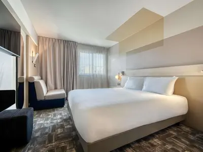 Un ou plusieurs lits dans un hébergement de l'établissement Mercure Paris 15 Porte de Versailles