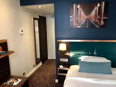 Un ou plusieurs lits dans un hébergement de l'établissement Best Western Empire Elysees