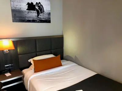 Un ou plusieurs lits dans un hébergement de l'établissement Best Western Empire Elysees
