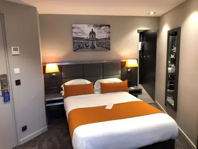 Un ou plusieurs lits dans un hébergement de l'établissement Best Western Empire Elysees