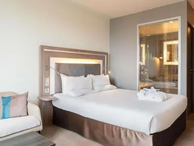 Un ou plusieurs lits dans un hébergement de l'établissement Novotel Paris 17