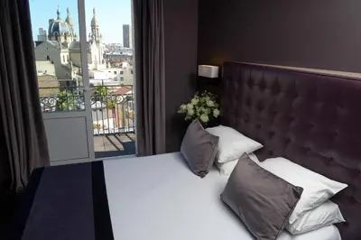Un ou plusieurs lits dans un hébergement de l'établissement Hôtel Saint-Charles