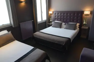 Un ou plusieurs lits dans un hébergement de l'établissement Hôtel Saint-Charles