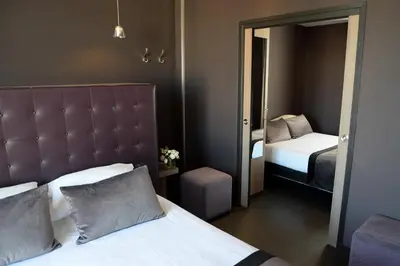 Un ou plusieurs lits dans un hébergement de l'établissement Hôtel Saint-Charles