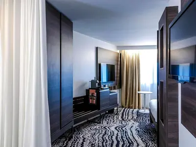 Un ou plusieurs lits dans un hébergement de l'établissement Novotel Paris 14 Porte d'Orléans
