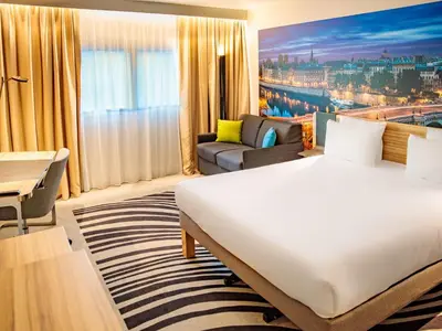 Un ou plusieurs lits dans un hébergement de l'établissement Novotel Paris 14 Porte d'Orléans