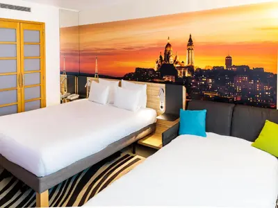 Un ou plusieurs lits dans un hébergement de l'établissement Novotel Paris 14 Porte d'Orléans