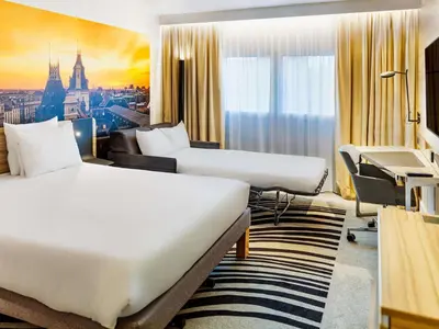 Un ou plusieurs lits dans un hébergement de l'établissement Novotel Paris 14 Porte d'Orléans