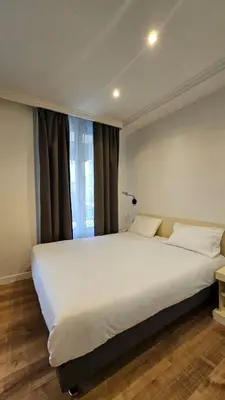 Un ou plusieurs lits dans un hébergement de l'établissement HOTEL PARIS PANAM-PERE LACHAISE-PLACE GAMBETTA-HOPITAL TENON-REPUBLIQUe