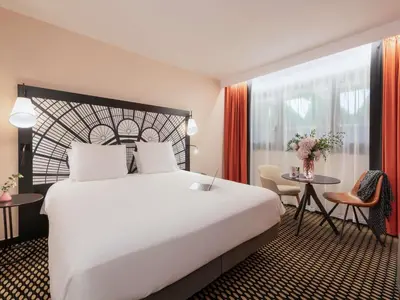 Un ou plusieurs lits dans un hébergement de l'établissement Mercure Paris Porte De Versailles Expo