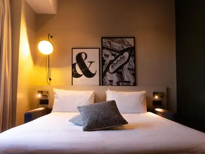 Un ou plusieurs lits dans un hébergement de l'établissement Mercure Paris Tour Eiffel Pont Mirabeau