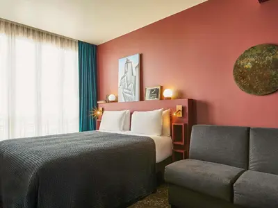 Un ou plusieurs lits dans un hébergement de l'établissement Mercure Paris Tour Eiffel Pont Mirabeau