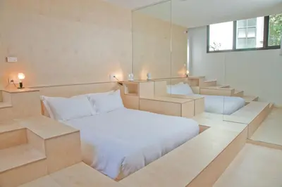 Un ou plusieurs lits dans un hébergement de l'établissement La Maison Champs Elysées