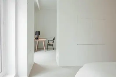 Un ou plusieurs lits dans un hébergement de l'établissement La Maison Champs Elysées