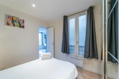 Un ou plusieurs lits dans un hébergement de l'établissement GH Apartment Pasteur-Montparnasse