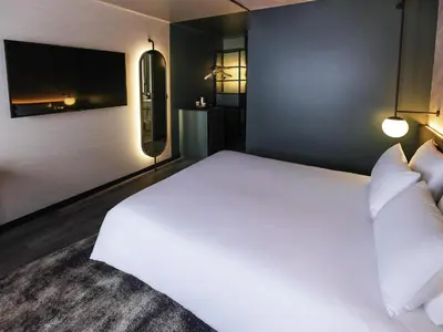 Un ou plusieurs lits dans un hébergement de l'établissement Novotel Paris Suresnes Longchamp
