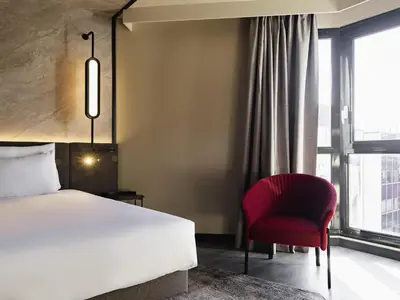 Un ou plusieurs lits dans un hébergement de l'établissement Novotel Paris Suresnes Longchamp