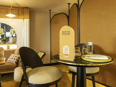 Coin salon dans l'établissement Novotel Paris Suresnes Longchamp