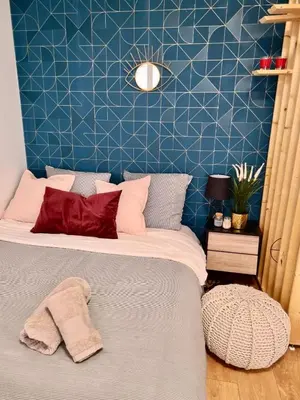 Un ou plusieurs lits dans un hébergement de l'établissement Cosy Appart Hotel Boulogne -Paris