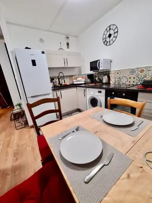 Cuisine ou kitchenette dans l'établissement Cosy Appart Hotel Boulogne -Paris