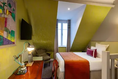 Un ou plusieurs lits dans un hébergement de l'établissement Hôtel Le Relais des Halles