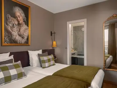 Un ou plusieurs lits dans un hébergement de l'établissement Hôtel Zélie Champs-Elysées
