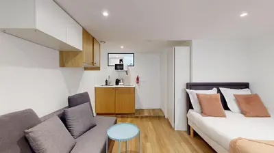Un ou plusieurs lits dans un hébergement de l'établissement 135 Suite Franck - Charmant Studio à Paris