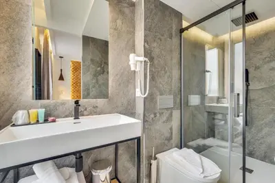 Salle de bains dans l'établissement Hotel Beausejour
