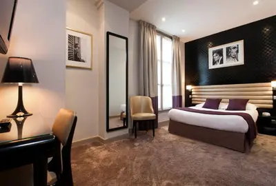 Un ou plusieurs lits dans un hébergement de l'établissement Hôtel ICÔNE