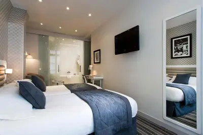 Un ou plusieurs lits dans un hébergement de l'établissement Hôtel ICÔNE