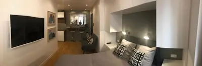 Télévision ou salle de divertissement dans l'établissement Studio design proche Champs-Elysées